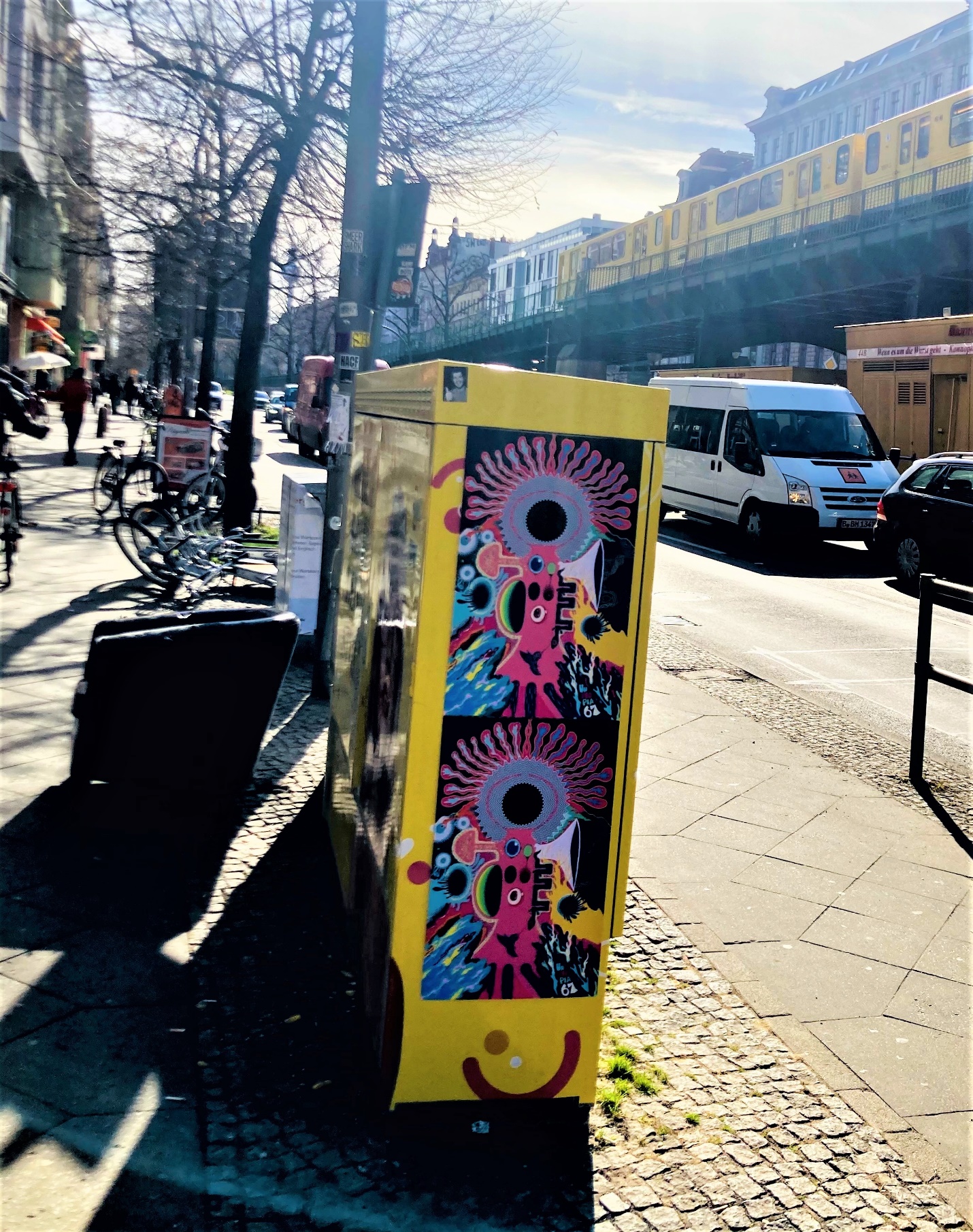 A couple of Unitopia 67 posters on an outdoor electrical box in the streets of Berlin.